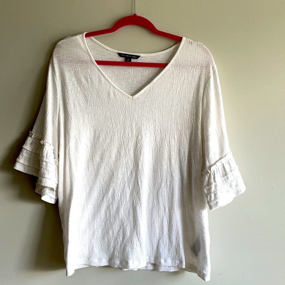 white ruffled top